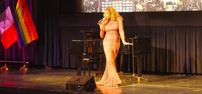 Miss Peppermint performing with her own candy charm at State Senator Erik Bottcher’s inauguration ceremony at the AMNH.