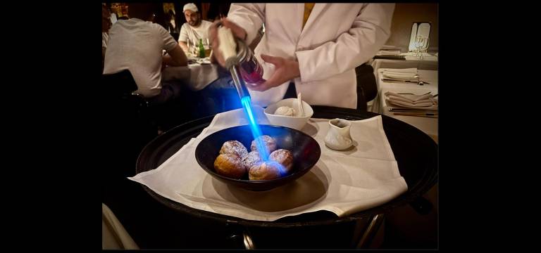 Philippe Chow’s server torches dessert at tableside.