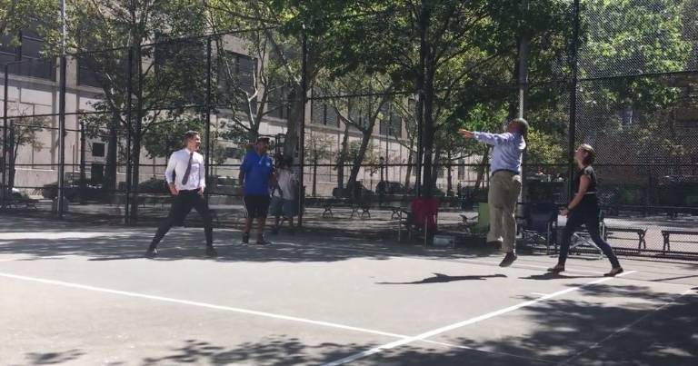State Senator Brad Hoylman, white shirt, and Parks Department Commissioner Michael Silver, blue shirt at right, have a go on new handball courts in Chelsea Park. Photo: Madeleine Thompson