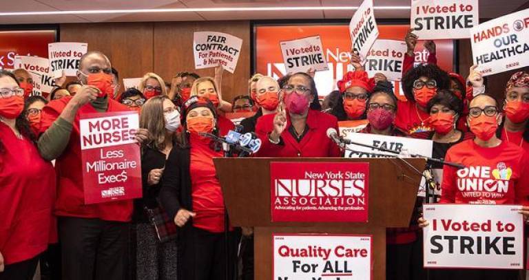 New York State Nurses Association president Nancy Hagans (at mic) led about 7,100 nurses on strike at Mount Sinai and Montefiore Hosptials starting Jan. 9