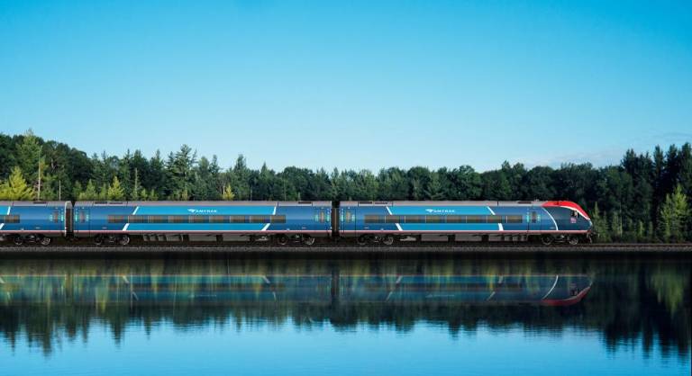 While this rendition’s locale is fictitious, it bears a resemblance to parts of Amtrak’s Adirondack route between New York City and Montreal, suspended since the beginning of the pandemic and slated to be resumed. Photo courtesy of Amtrak