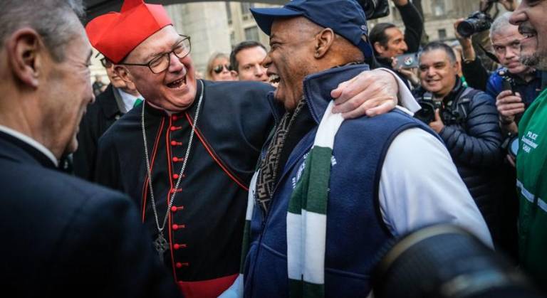 Cardinal Timothy Dolan greets Mayor Eric Adams at the 2024 St. Patrick’s Day Parade. Adams tenure comes to a close at year end and rumors are swirling that Pope Leo may soon accept the resignation of Dolan and appoint a successor.