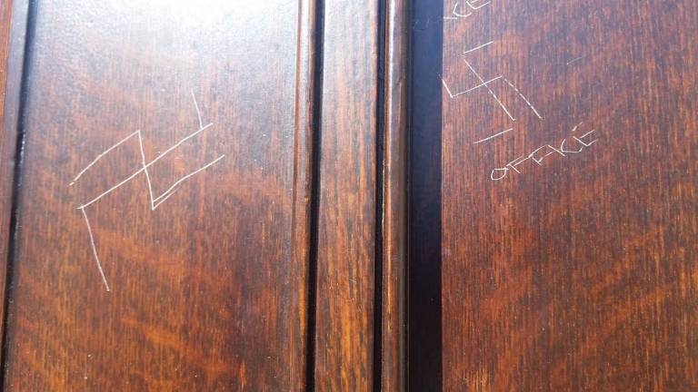 Two swastikas were carved on the front door of the Fourth Universalist Society on the Upper West Side in February 2017. Photo: Rev. Schuyler Vogel