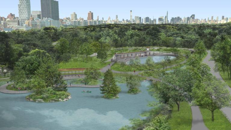 A bird's-eye view of the reimagined north end of Central Park, looking south, with the Harlem Meer in the foreground, a boardwalk that traverses a freshwater marsh and a series of small islands (center left) and the new oval-shaped Lasker pool and skating rink (center right).