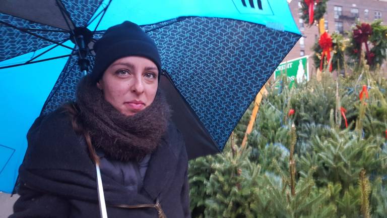 Carla Alcalde at the Seventh Avenue tree stand she runs with Mirko Deluca. Photo: Diamond Naga Siu