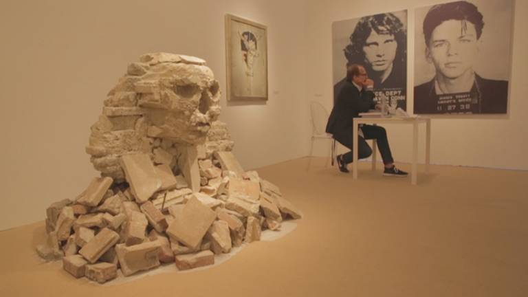 Southampton gallerist and Banksy dealer Steven Keszler sits beside Banksy's sphinx replica, which was extracted from its Flushing, Queens location on Oct. 22, 2013. Photo credit: Mai Iskander/Courtesy of HBO