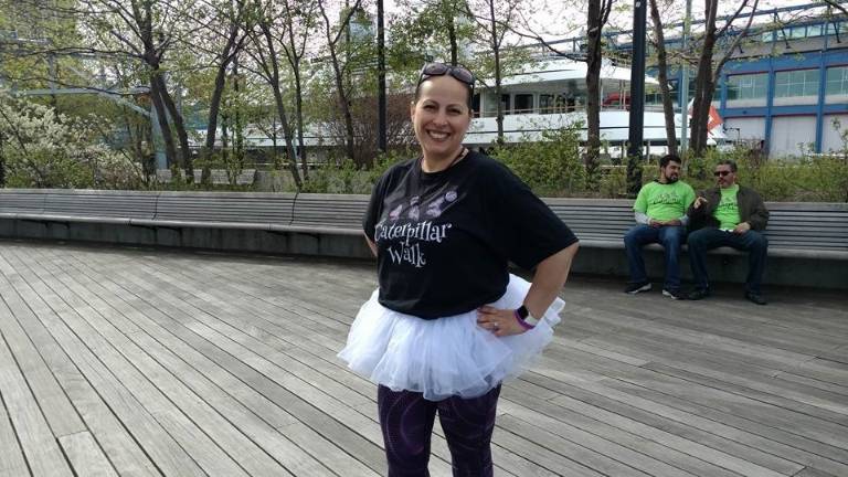 Milly Velez finishes the Caterpillar Walk in high spirits on Saturday. Photo courtesy of Ciara Serpa.
