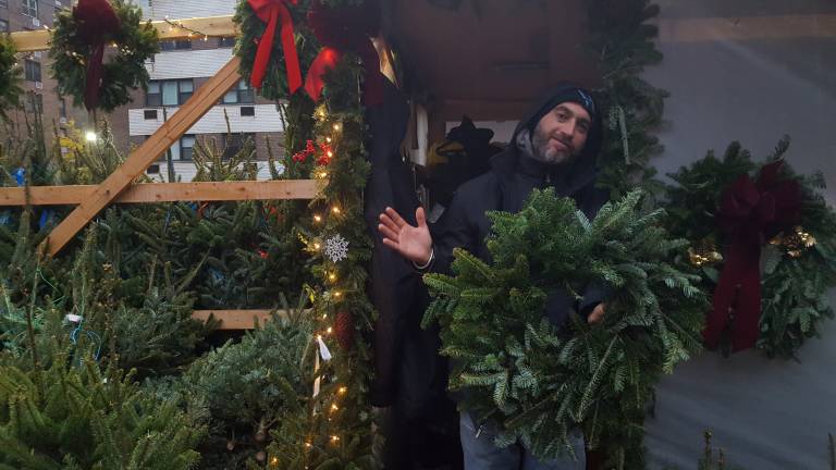 Mirko Deluca at the Seventh Avenue tree stand. Photo: Diamond Naga Siu