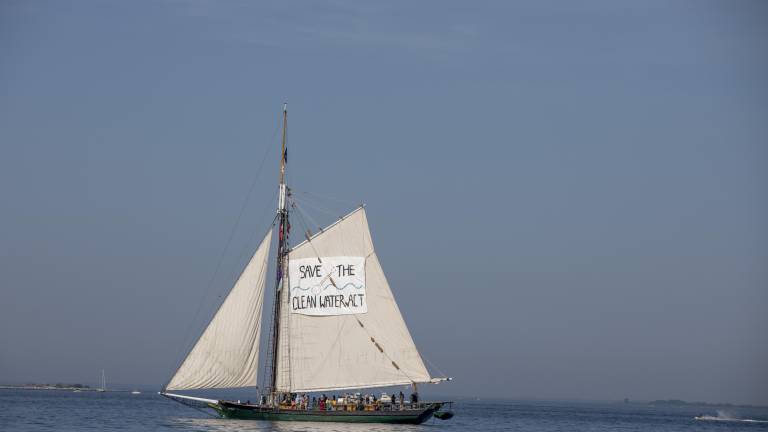The Clearwater sloop (above) sailing south towards the Verrazzano-Narrows Bridge on the morning of the July 4th Sail Parade. Its sail reads, “Save the Clean Water Act,” as part of the organization’s efforts towards environmental advocacy.
