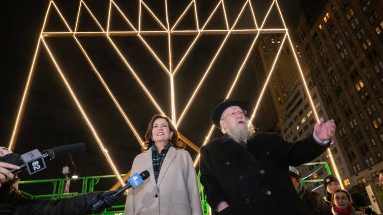 Governor Kathy Hochul participates in a menorah lighting on the first night of Hanukkah, alongside Rabbi Shmuel Butman of the Lubavitch Youth Organization. It took place at the world’s largest menorah, located at Central Park South’s Grand Army Plaza.