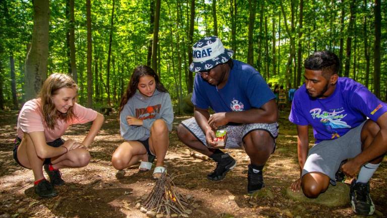 There is a fine art to building a campfire as campers at the Nature Place Camp in Chestnut Ridge in Rockland County discover. Photo: The Nature Place