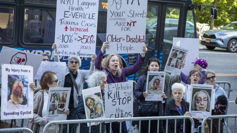 Protesters gather outside Transportation Alternatives’ annual fundraiser to call for stricter regulation of e-bikes and other micromobility devices.