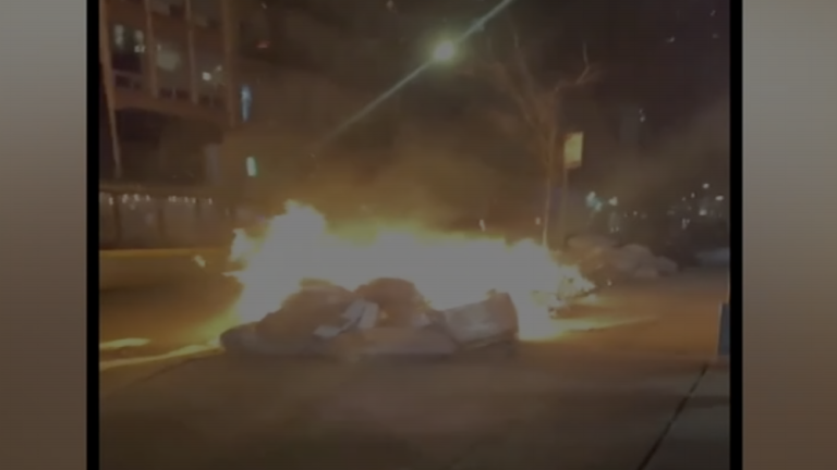 Two police cars were set on fire on West 29th Street. <b>Photo: ABC 7.</b>