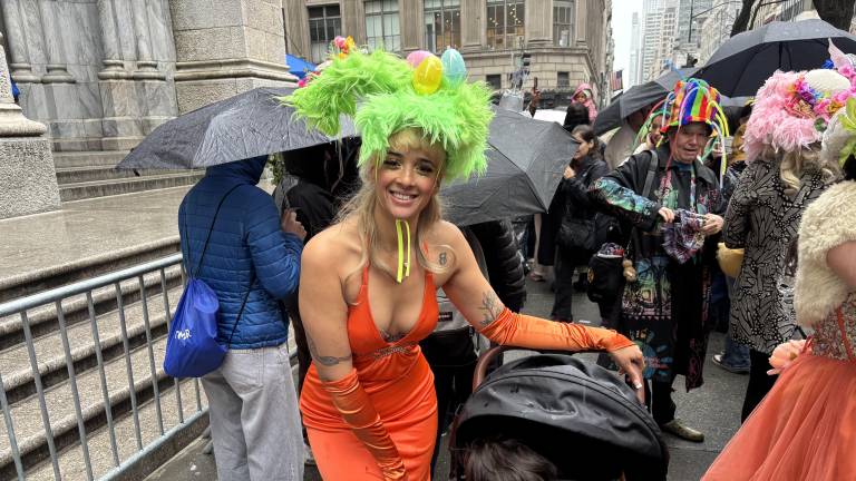 Easter eggs adorned Melissa Vento’s bonnet, while she pushed her son in a stroller through the crowd of revelers at the Easter Parade.