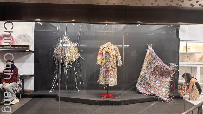 Works by Chin-Chih Yang are displayed behind the glass storefront of White Box Portable, a gallery located inside the Times Square subway complex.