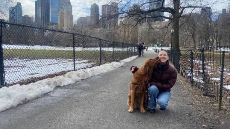 Olivia Bannerman, aka “the Poop Fairy” with the “light of her life,” her golden retriever Violet.
