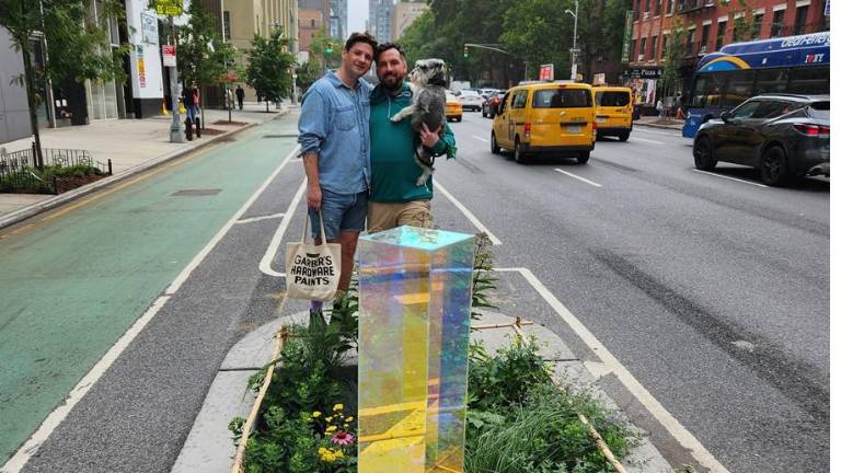 Alex Chapman and Pete Fehn with their dog Elvis at Itty Island on Tenth Avenue in Chelsea.