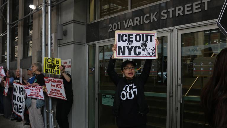 Protestors stood outside of 201 Varick St., which houses one of the city’s immigration courts.