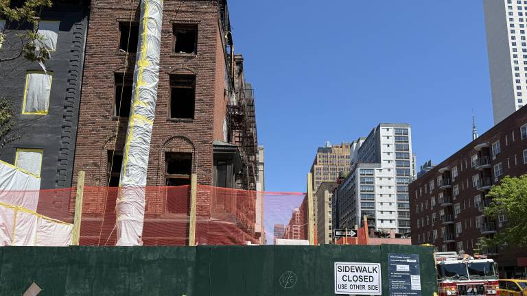 The demolition of 210 7th Ave. is expected to be completed in June.