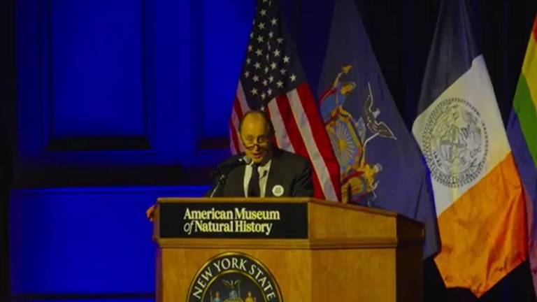 Gay rights activist Allan Roskoff speaking at State Senator Erik Bottcher’s inauguration ceremony at the AMNH.